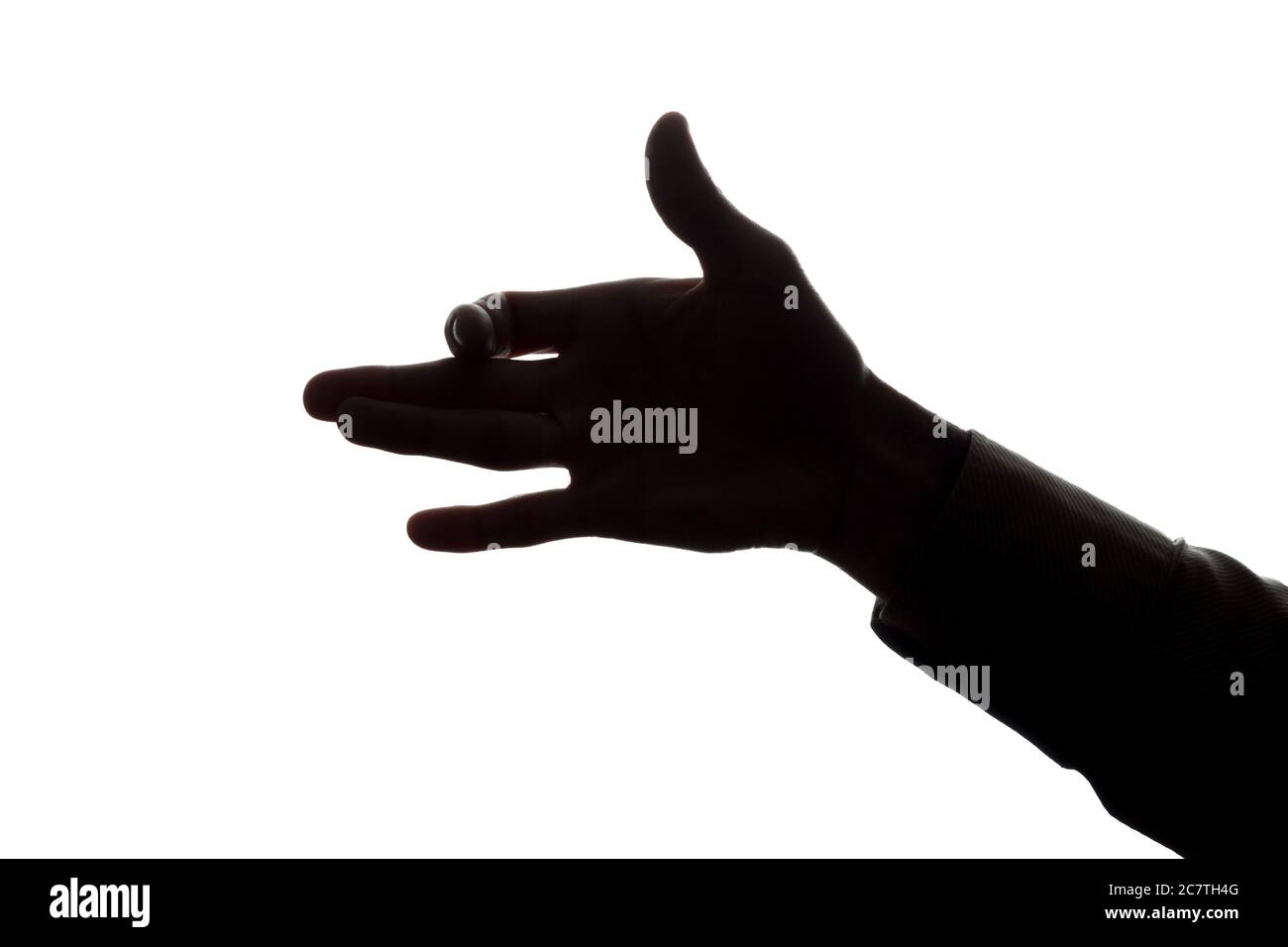 Man's hand shows a symbol of a dog - silhouette Stock Photo - Alamy