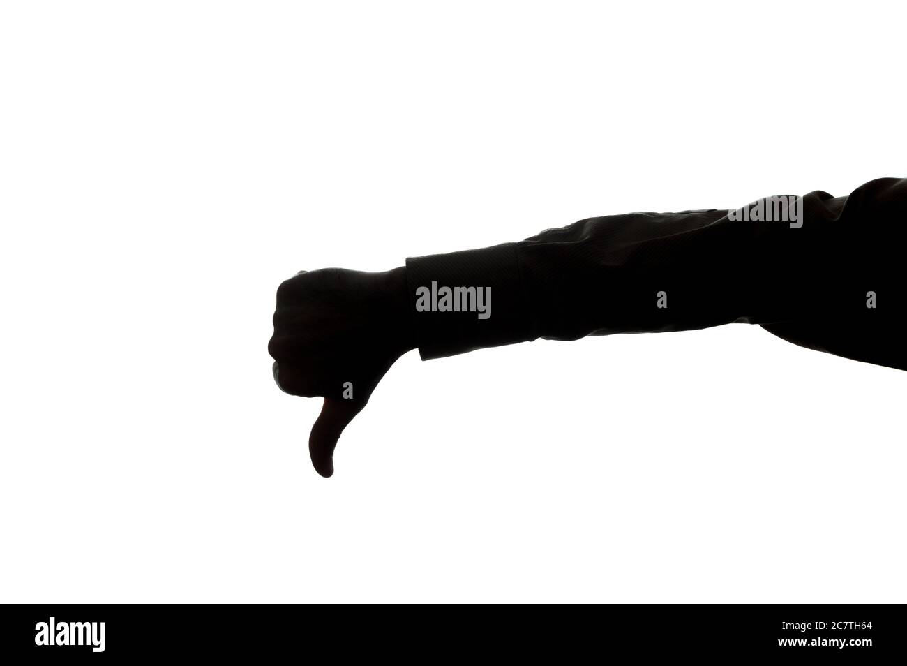 Man's hand shows a symbol of a thumb down - silhouette Stock Photo - Alamy