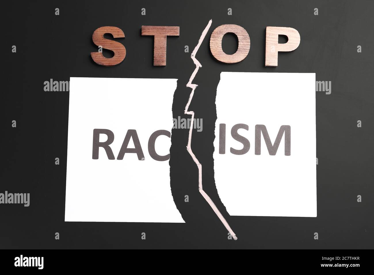 Text STOP RACISM on dark background Stock Photo - Alamy