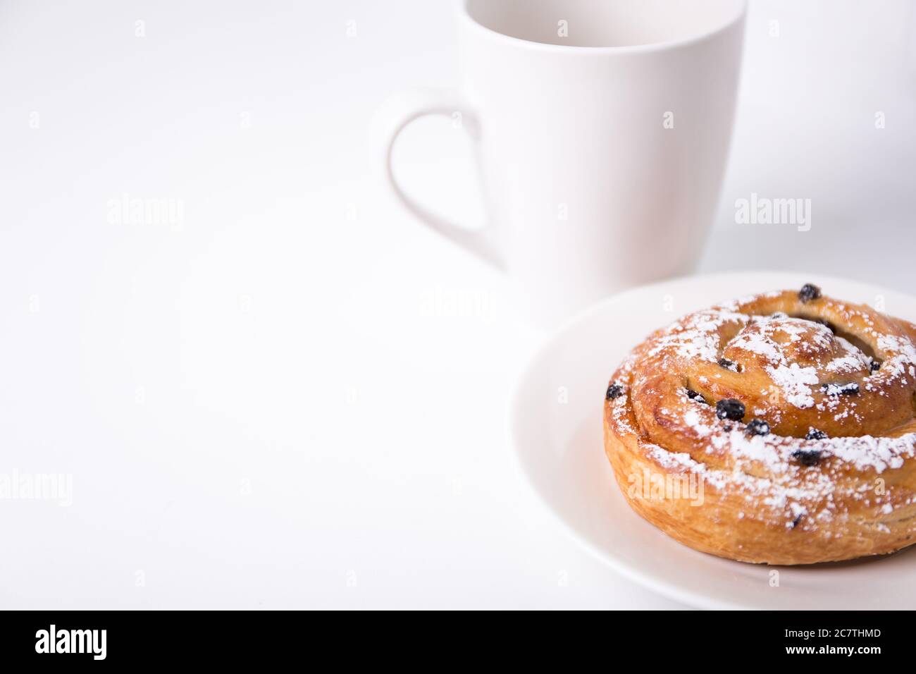 Breakfast Concept Sweet Bun With Raisins And Cup Of Coffee Or Tea Over White Background Stock Photo Alamy Breakfast Concept Sweet Bun With Raisins And Cup Of Coffee Or Tea Over White Background Stock Photo Alamy