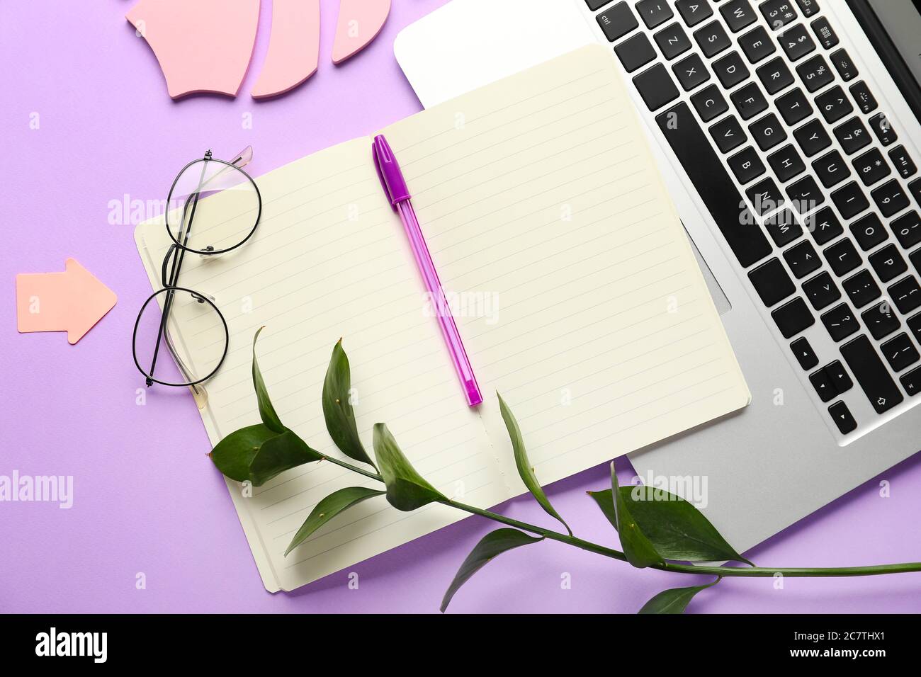 Composition with notebook and laptop on color background Stock Photo
