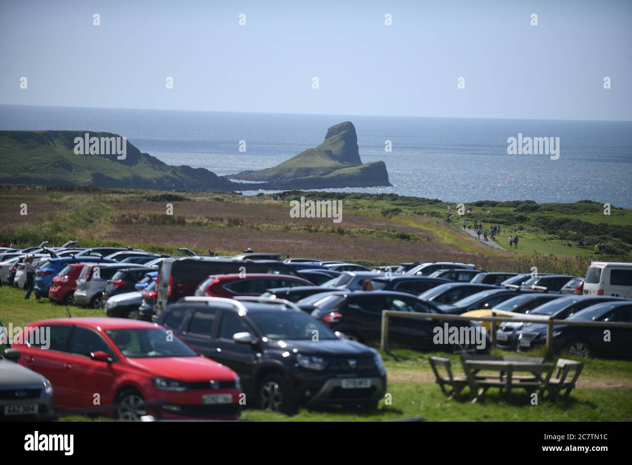 19th July 2020. Rhossili, Gower, Wales. Cars pack into the car park at Rhossili in Gower as people head towards the iconic Worms Head on the first day of the Summer Holidays and people enjoy the more relaxed lockdown rules. Credit : Robert Melen/Alamy Live News Stock Photo