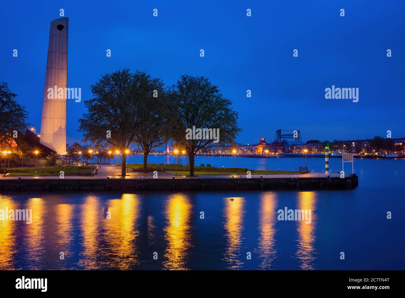 Rotterdam city river waterfront at night with De Boeg (The Bow) WWII war memorial monument, Holland, the Netherlands Stock Photo