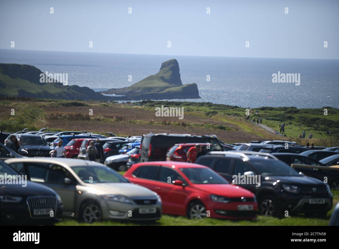 19th July 2020. Rhossili, Gower, Wales. Cars pack into the car park at Rhossili in Gower as people head towards the iconic Worms Head on the first day of the Summer Holidays and people enjoy the more relaxed lockdown rules. Credit : Robert Melen/Alamy Live News Stock Photo