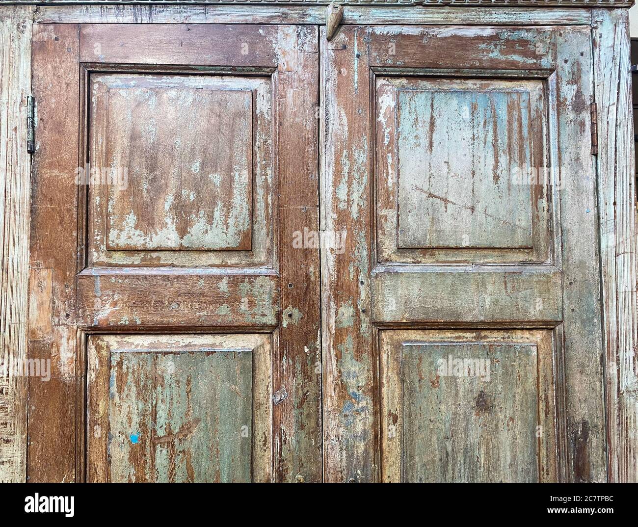 View on isolated weathered old retro wardrobe wood door Stock Photo