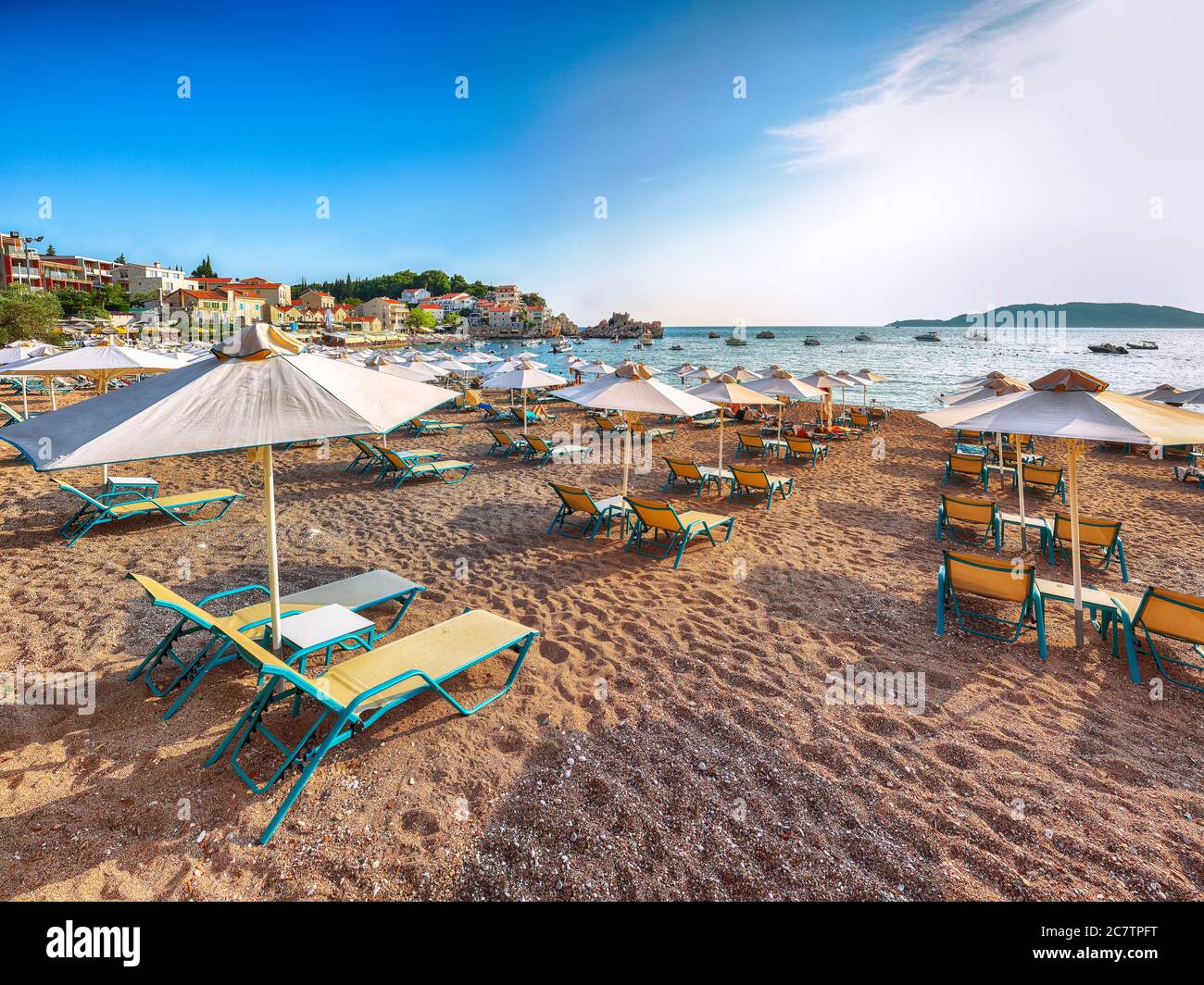 Picturesque summer view of Adriatic sea coast in Budva Riviera near Przno village. Cozy beach and buildings on the rock. Location: Przno village, Mont Stock Photo