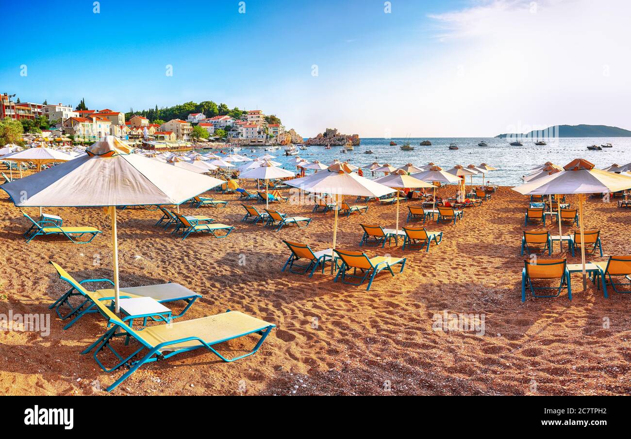 Picturesque summer view of Adriatic sea coast in Budva Riviera near Przno village. Cozy beach and buildings on the rock. Location: Przno village, Mont Stock Photo