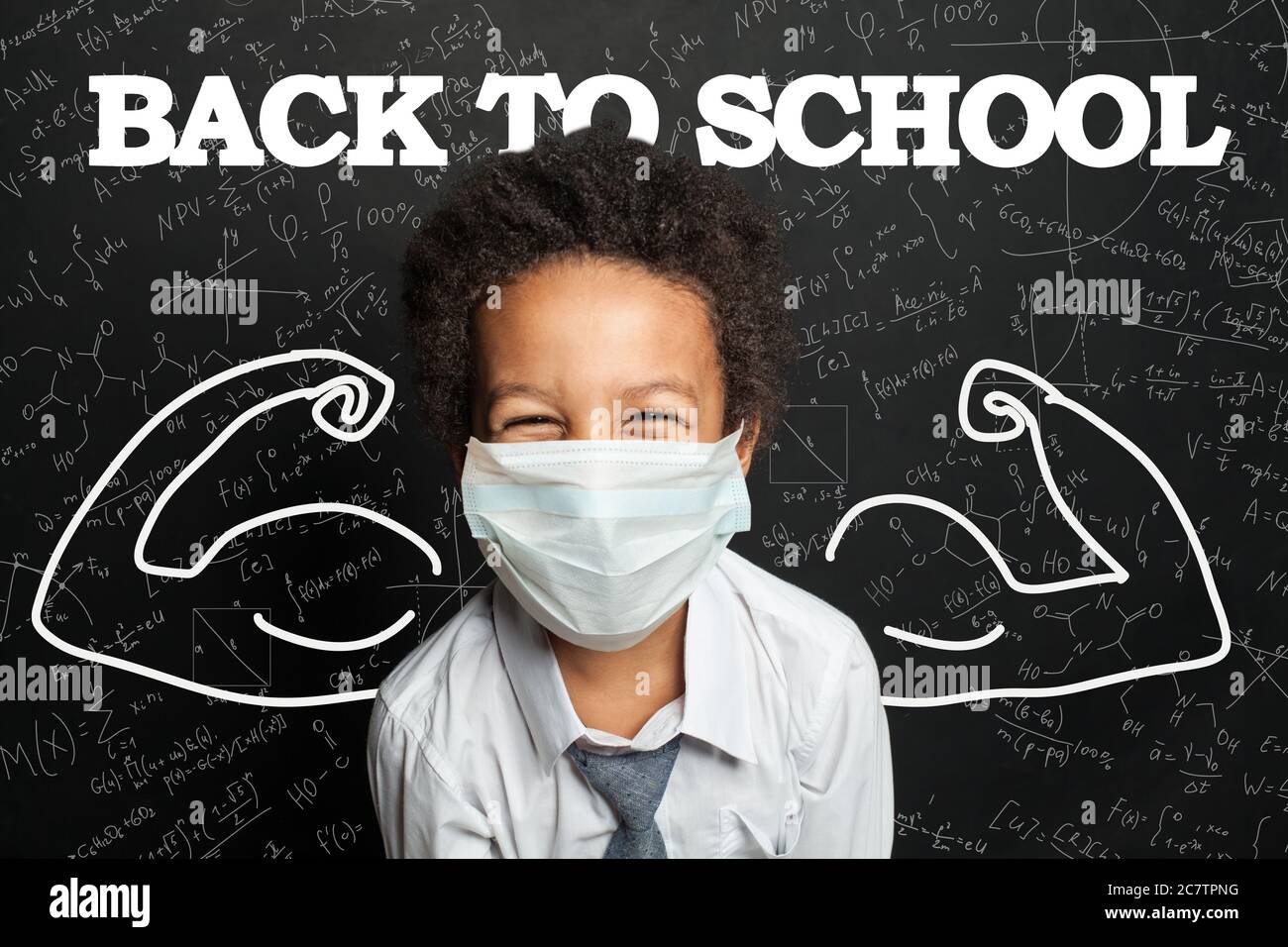 Happy child student in medical protective face mask on blackboard ...