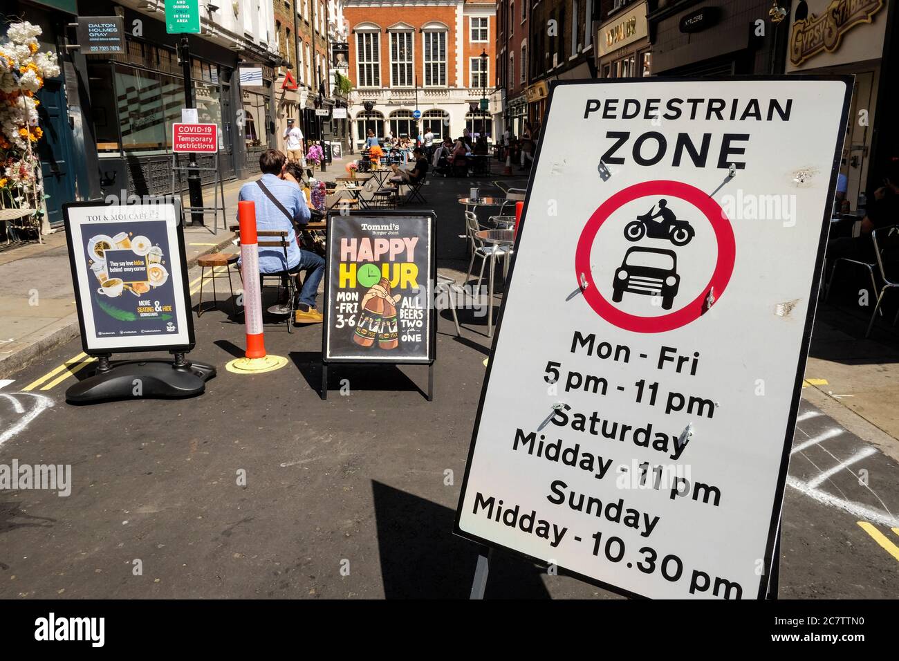 18th July 2020. Streets in the Soho area of central London have been pedestrianised to allow bars and restaurants to set up outdoor seating areas to maintain social distancing regulations between customers as Covid-19 easing measures are implemented by the government. Stock Photo