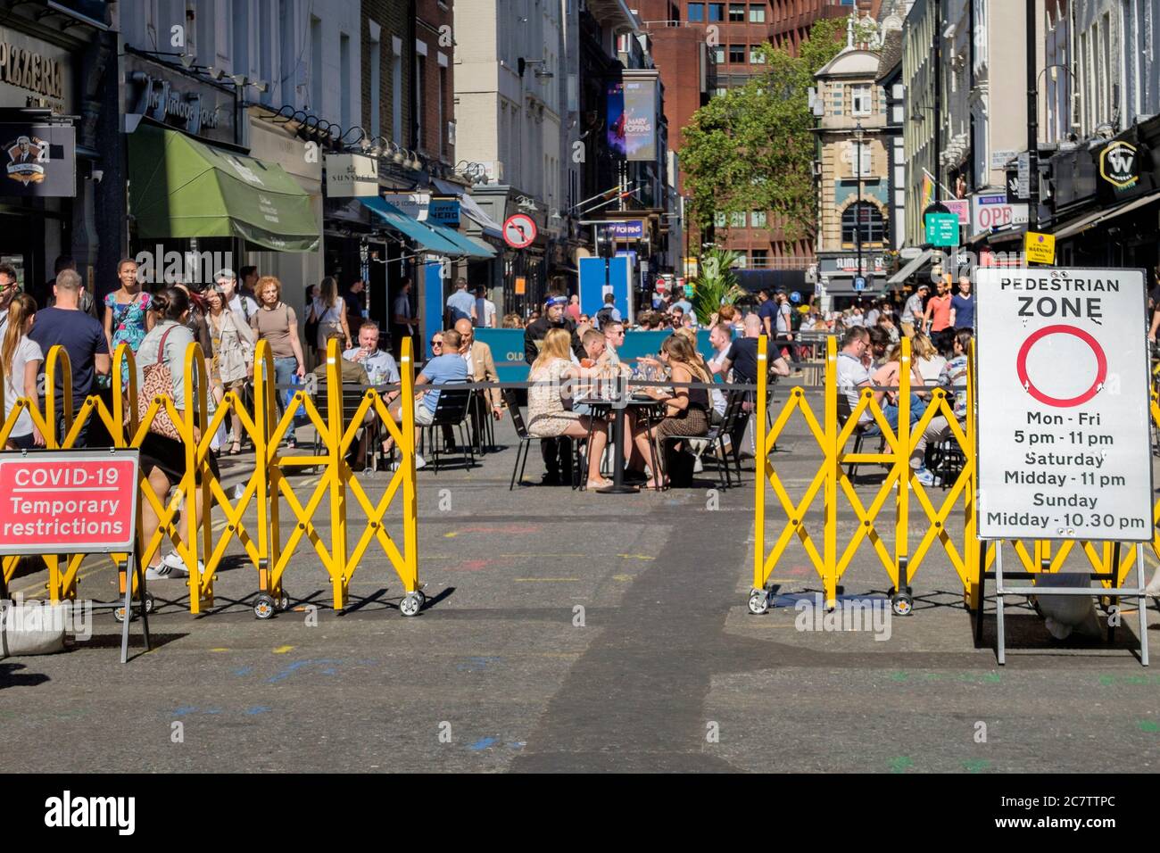 18th July 2020. Streets in the Soho area of central London have been pedestrianised to allow bars and restaurants to set up outdoor seating areas to maintain social distancing regulations between customers as Covid-19 easing measures are implemented by the government. Stock Photo