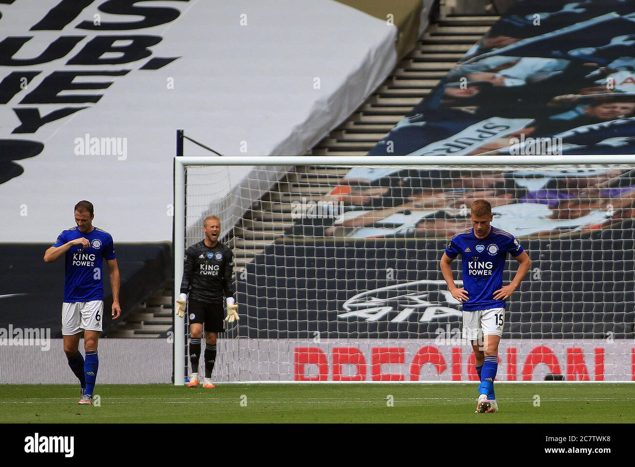 Leicester players Kasper Schmeichel (c), Jonny Evans (L) and Harvey Barnes (R) react and are dejected after Harry Kane of Tottenham Hotspur scores his teams third goal. Premier League match, Tottenham Hotspur v Leicester City at the Tottenham Hotspur Stadium in London onSunday 19th July 2020. this image may only be used for Editorial purposes. Editorial use only, license required for commercial use. No use in betting, games or a single club/league/player publications. pic by Steffan Bowen/Andrew Orchard sports photography/Alamy Live news Stock Photo