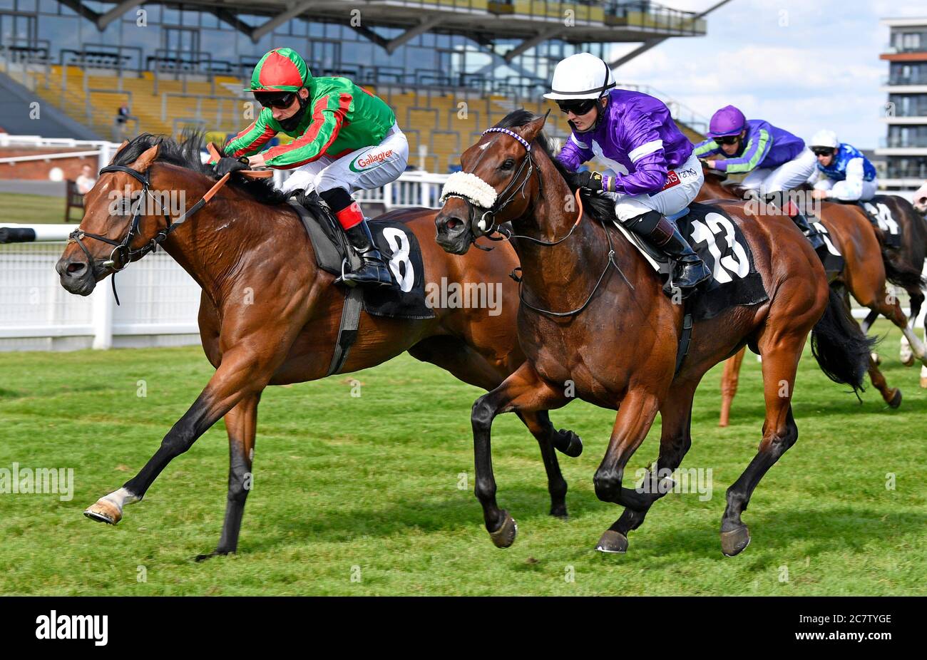 Karibana ridden by Shane Kelly (left) wins the Cash Out at bet365 Handicap Stakes at Newbury Racecourse. Stock Photo