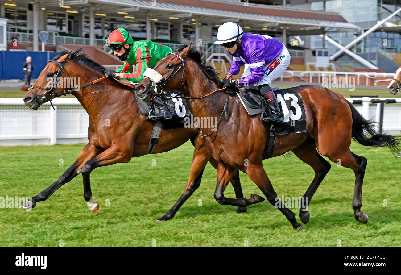 Karibana ridden by Shane Kelly (left) wins the Cash Out at bet365 Handicap Stakes at Newbury Racecourse. Stock Photo
