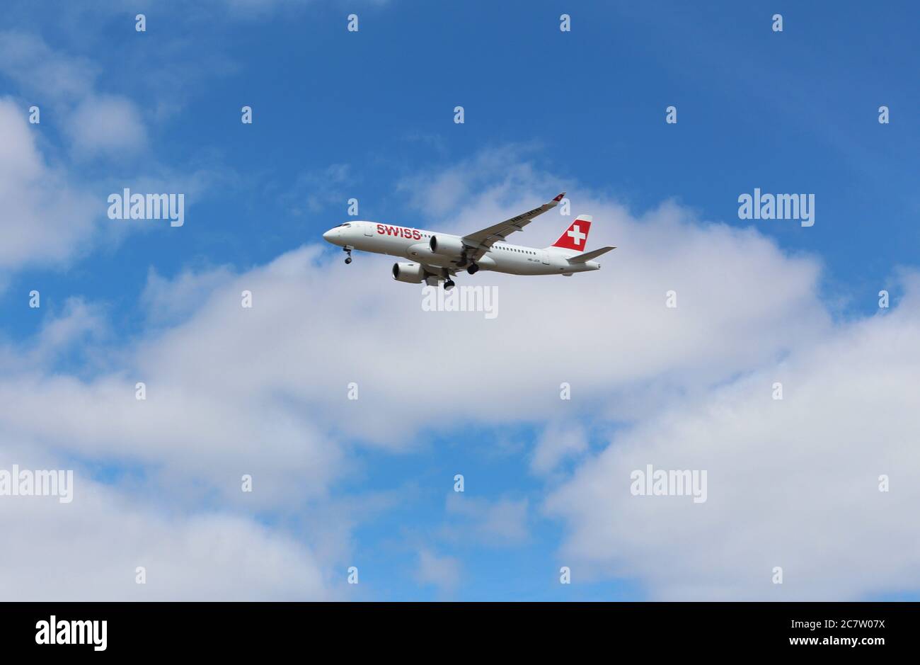 Hounslow, London - July 18th 2020: A Swiss, Airbus A220-300 Flight LX354 from Geneva (GVA) to London Heathrow (LHR), descends as it prepares to land. Stock Photo