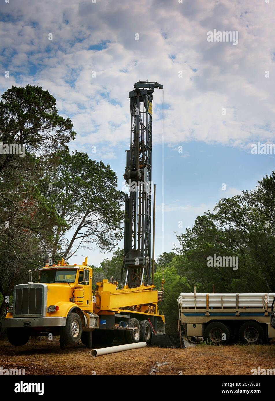 Drilling a water well on country land. Modern rotary drill rigs bore water well. Stock Photo