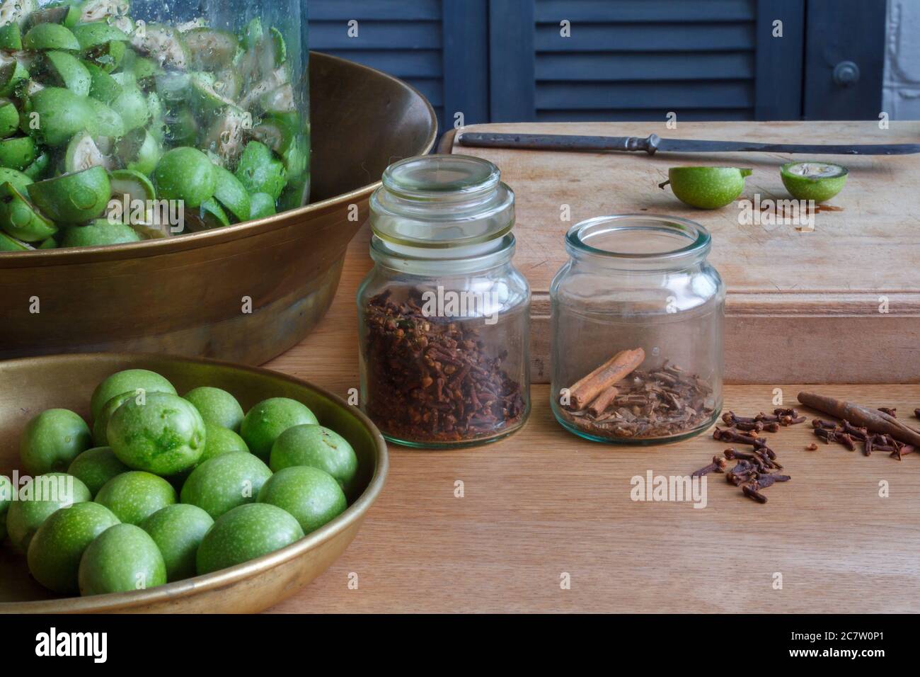 Step-by-step recipe for preparing Italian liquor nocino from green walnuts at home, real home kitchen and cooking, selective focus Stock Photo