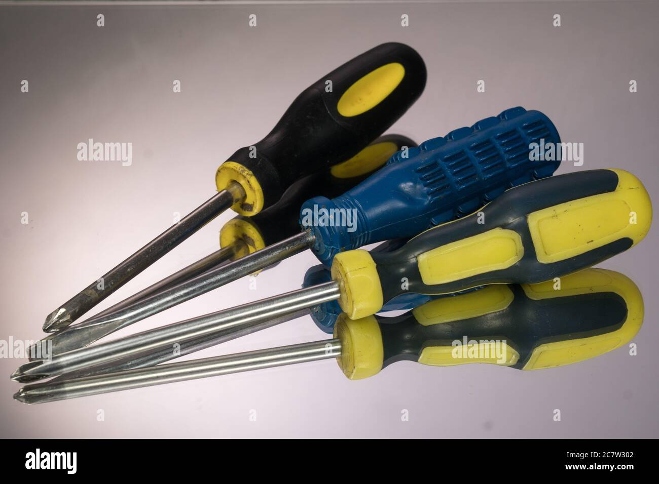 Screwdriver Set isolated on gray background. mirror reflection Stock Photo