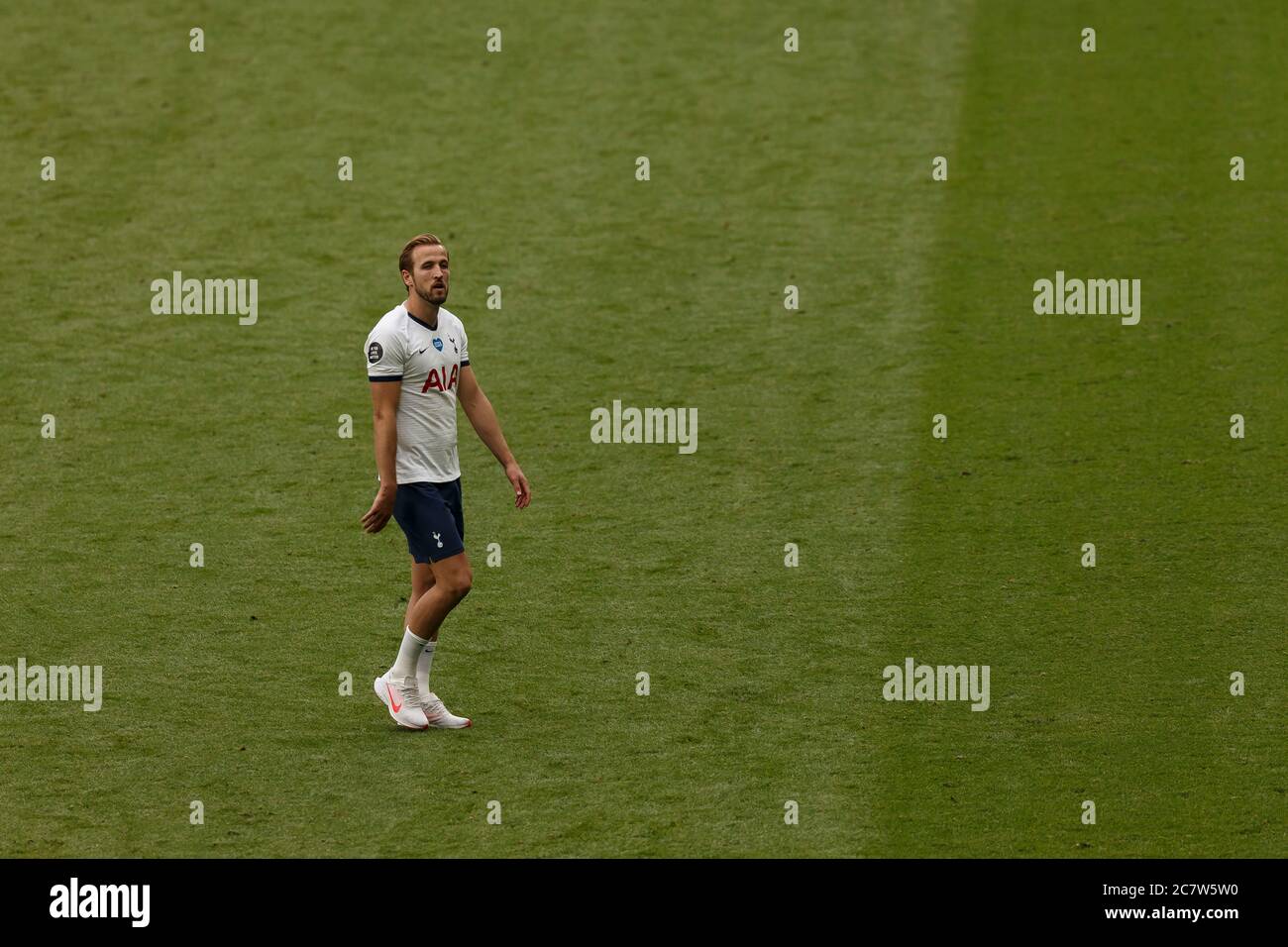 London, UK. 19th July, 2020. Harry Kane of Tottenham Hotspur crosses the pitch to fulfill his media duties after the Premier League match between Tottenham Hotspur and Leicester City at the Tottenham Hotspur Stadium on July 19th 2020 in London, England. (Photo by Daniel Chesterton/phcimages.com) Credit: PHC Images/Alamy Live News Stock Photo