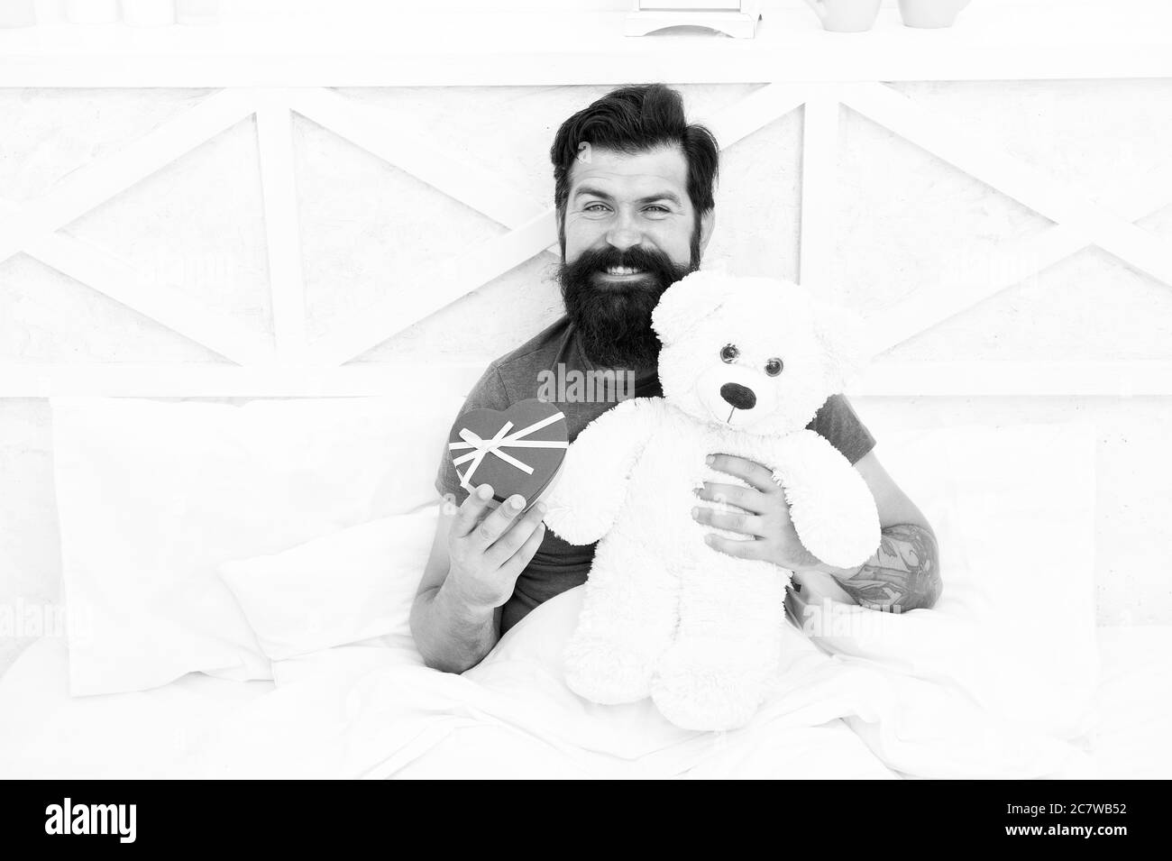 Online shop. my birthday. Happy adulthood. home shopping concept. Love and happiness. bearded man teddy bear in bed. Gift box for holidays. nice present for you. Valentines day morning Stock Photo