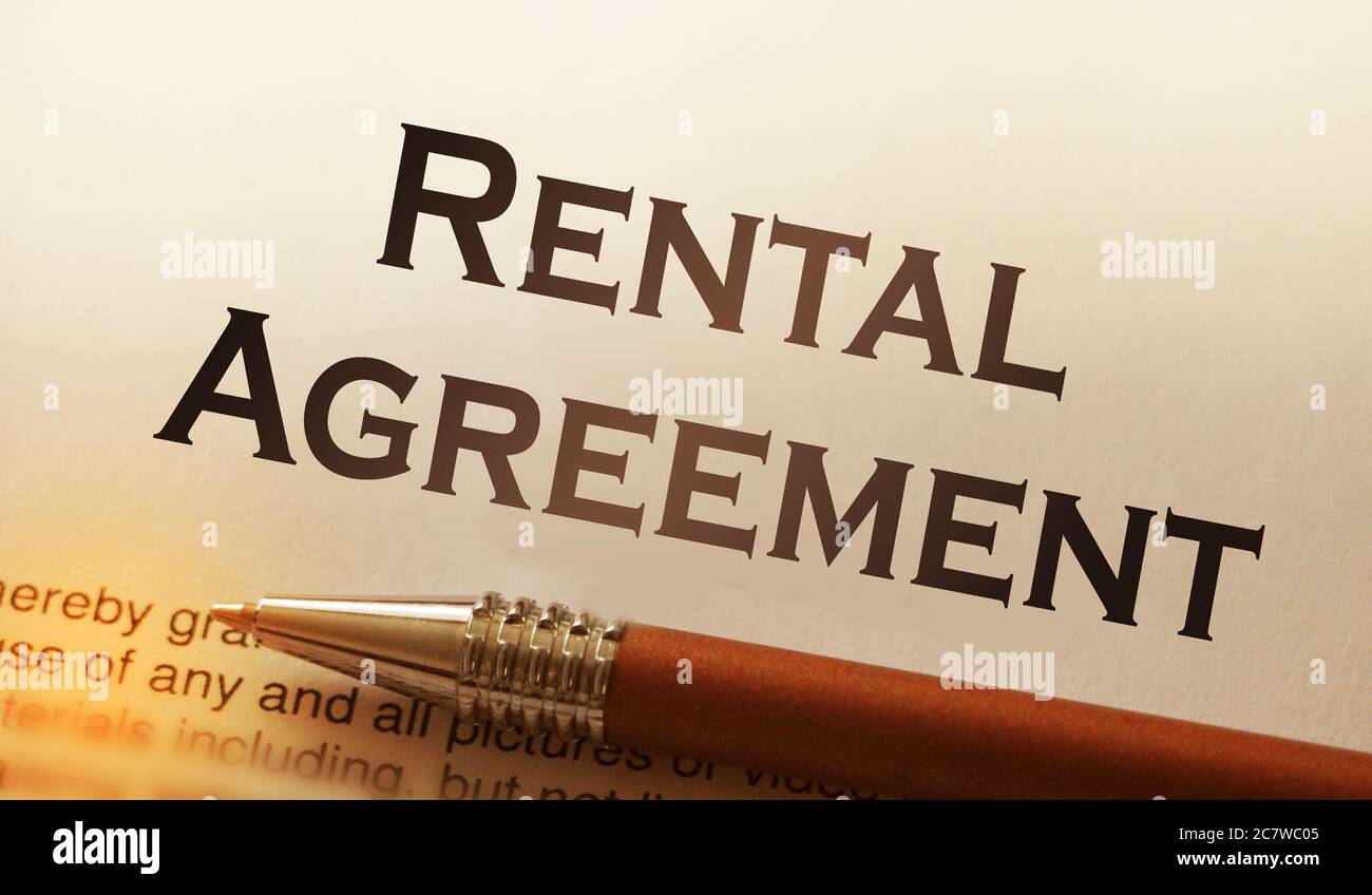 rental agreement form on desktop in business office showing real estate concept Stock Photo