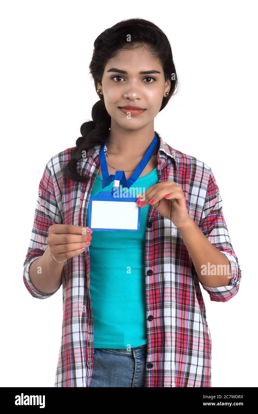 Young woman holding Identification white blank plastic id card Stock