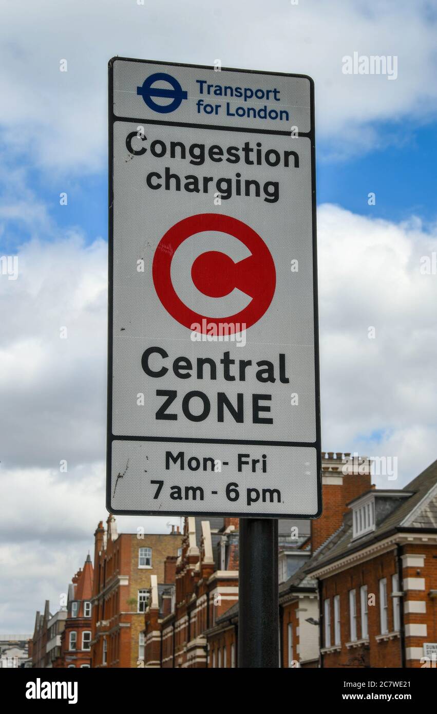 London, England - June 2018: Road sign in a central London street informing motorists the area is a congestion charging zone between certain hours Stock Photo