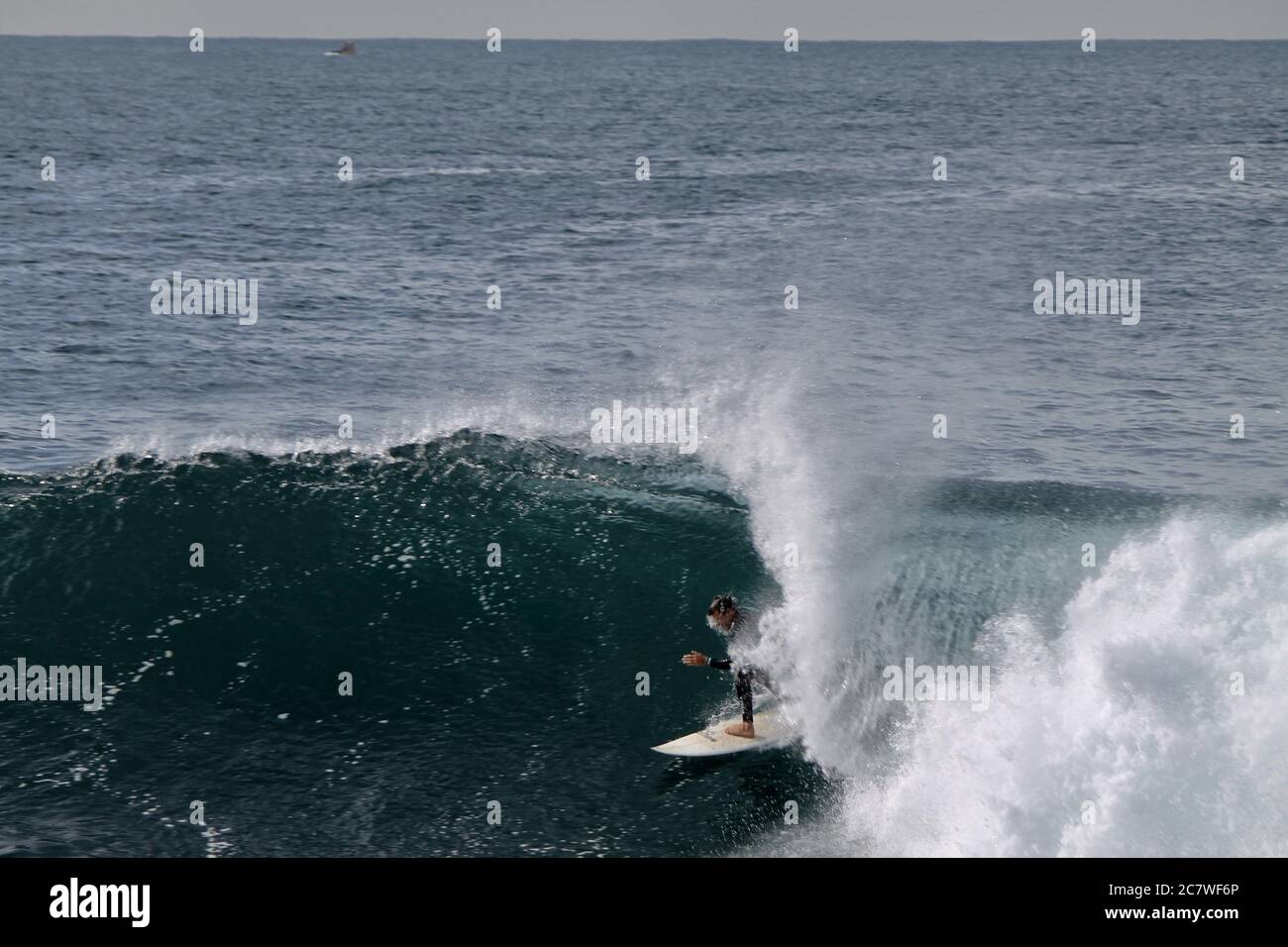 Surfer catching the wave Stock Photo - Alamy