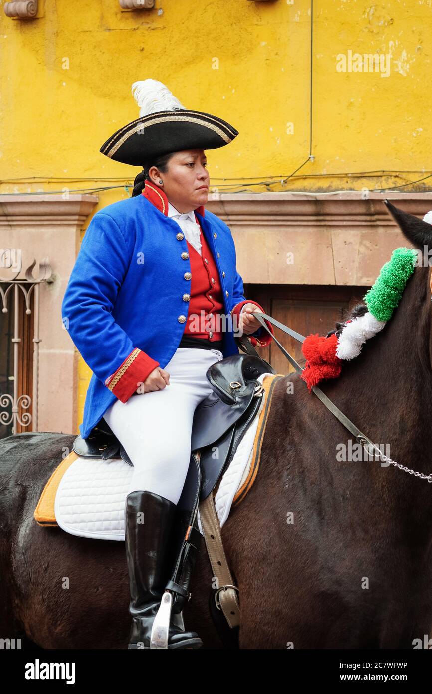 A historic actor rides a horse dressed in Spanish colonial uniform during a  parade celebrating the 251st birthday of Mexican Independence hero Ignacio  Allende January 21, 2020 in San Miguel de Allende,