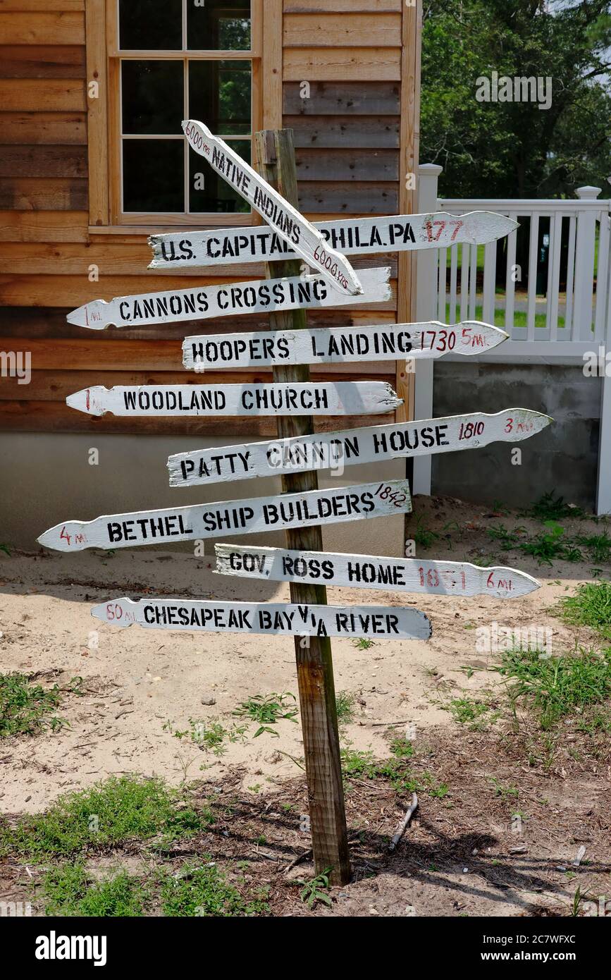 A wooden signpost directs viewers to Southern Delaware points of interest near to the restored Woodland School in Woodland Ferry, DE. Stock Photo