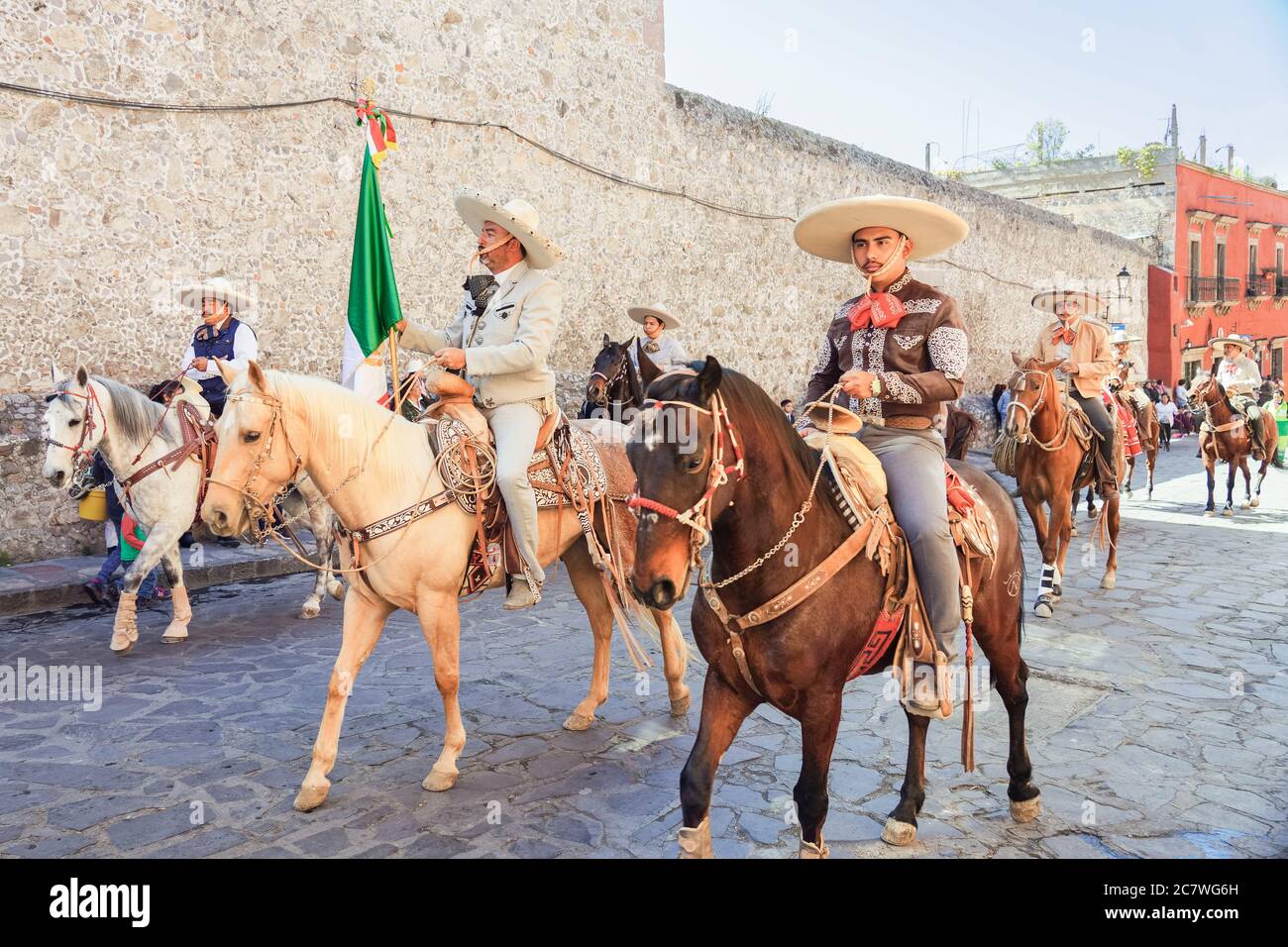 Mexican Cowboys ride their horses in a parade to celebrate the 251st birthday of the Mexican Independence hero Ignacio Allende January 21, 2020 in San Miguel de Allende, Guanajuato, Mexico. Allende, from a wealthy family in San Miguel played a major role in the independency war against Spain in 1810 and later honored by his home city by adding his name. Stock Photo