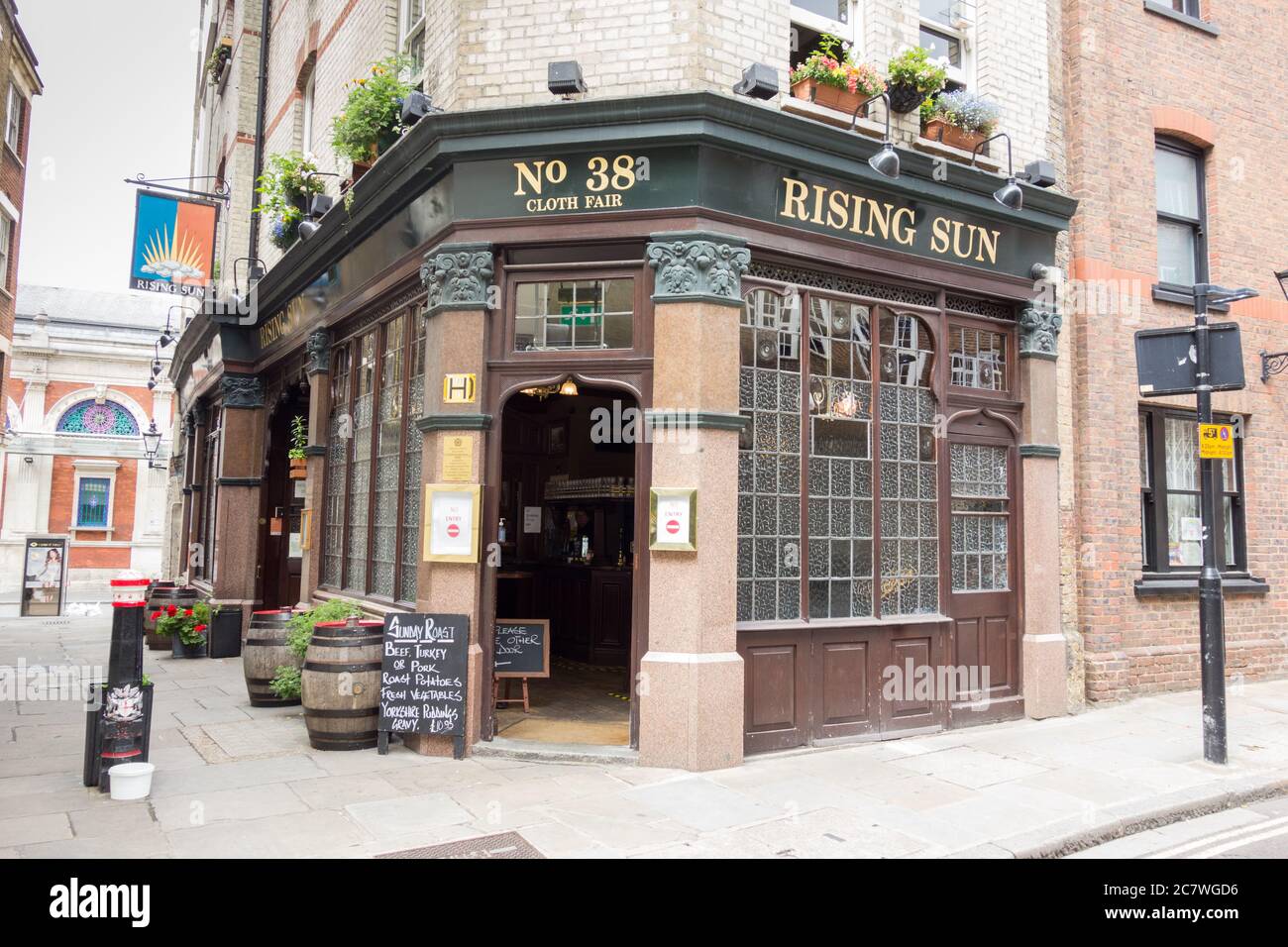 The entrance to the Rising Sun public house on Cloth Fair, Smithfield, London, EC1, UK Stock