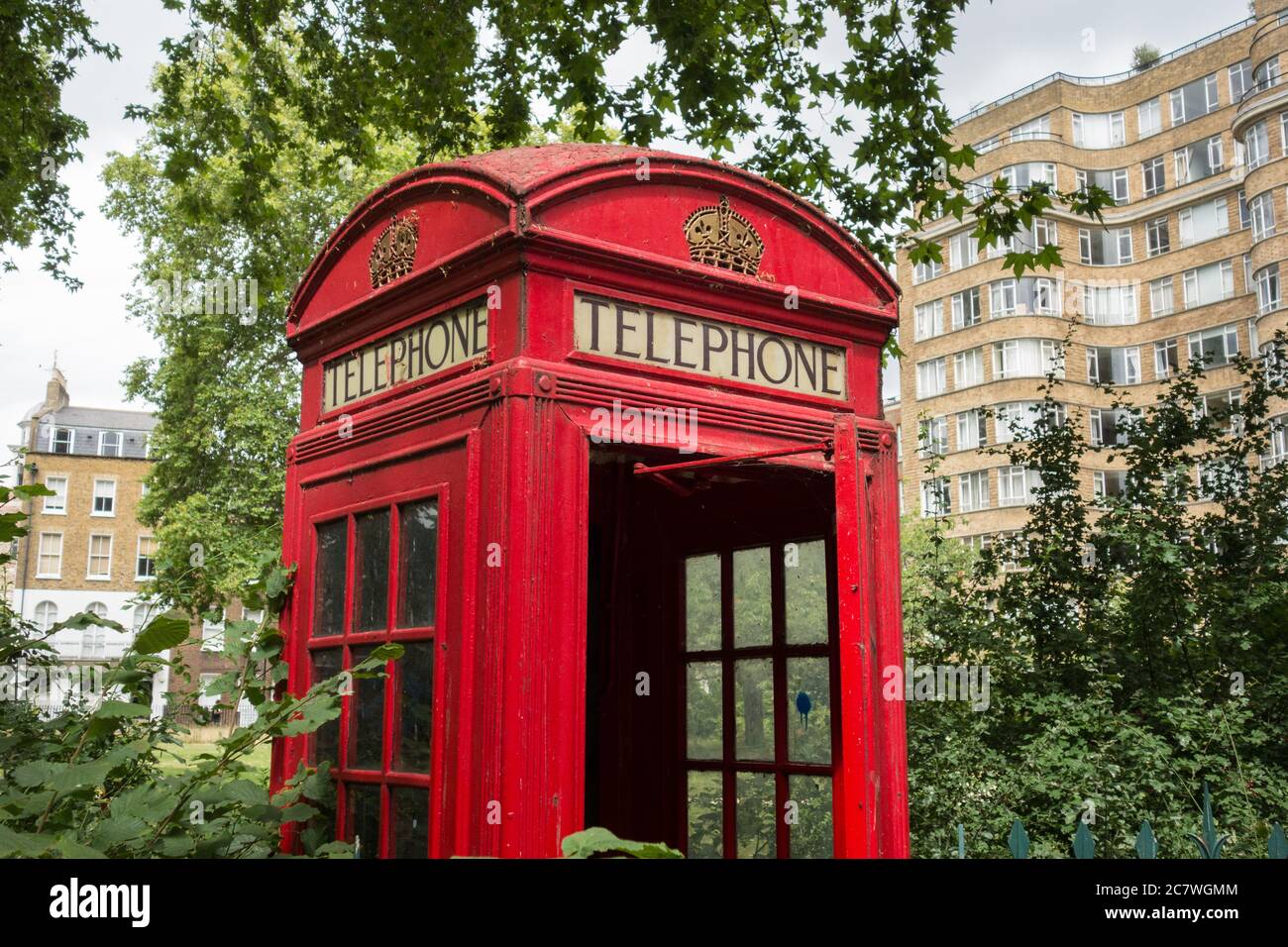 Closeup of an iconic Gilbert Scott K6 red telephone kiosk on Charterhouse Square, London, EC1, UK Stock Photo