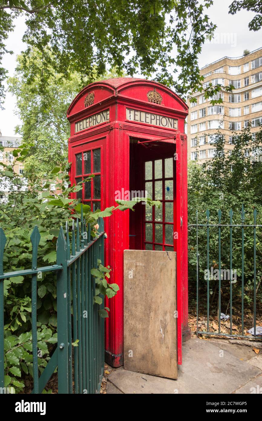 An iconic Gilbert Scott K6 red telephone kiosk on Charterhouse Square, London, EC1, UK Stock Photo