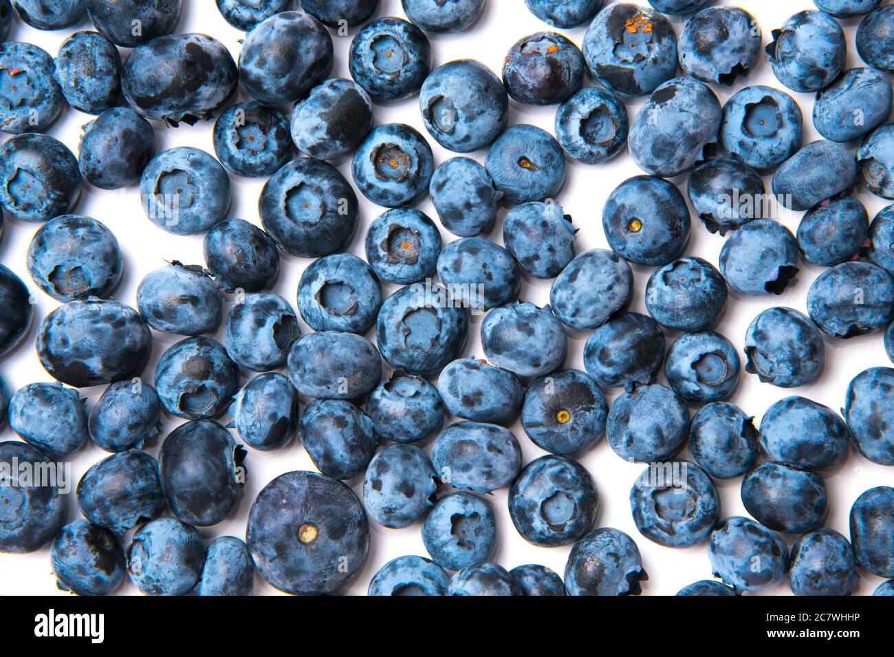 Ripe blueberries scattered on white background Stock Photo