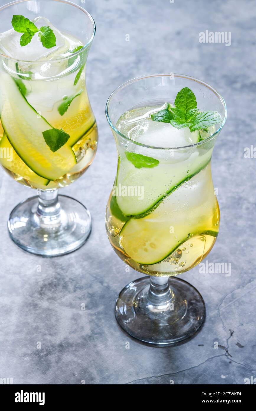 Elderflower and apple juice mocktail with cucumber, mint and ice cubes refreshing summer non