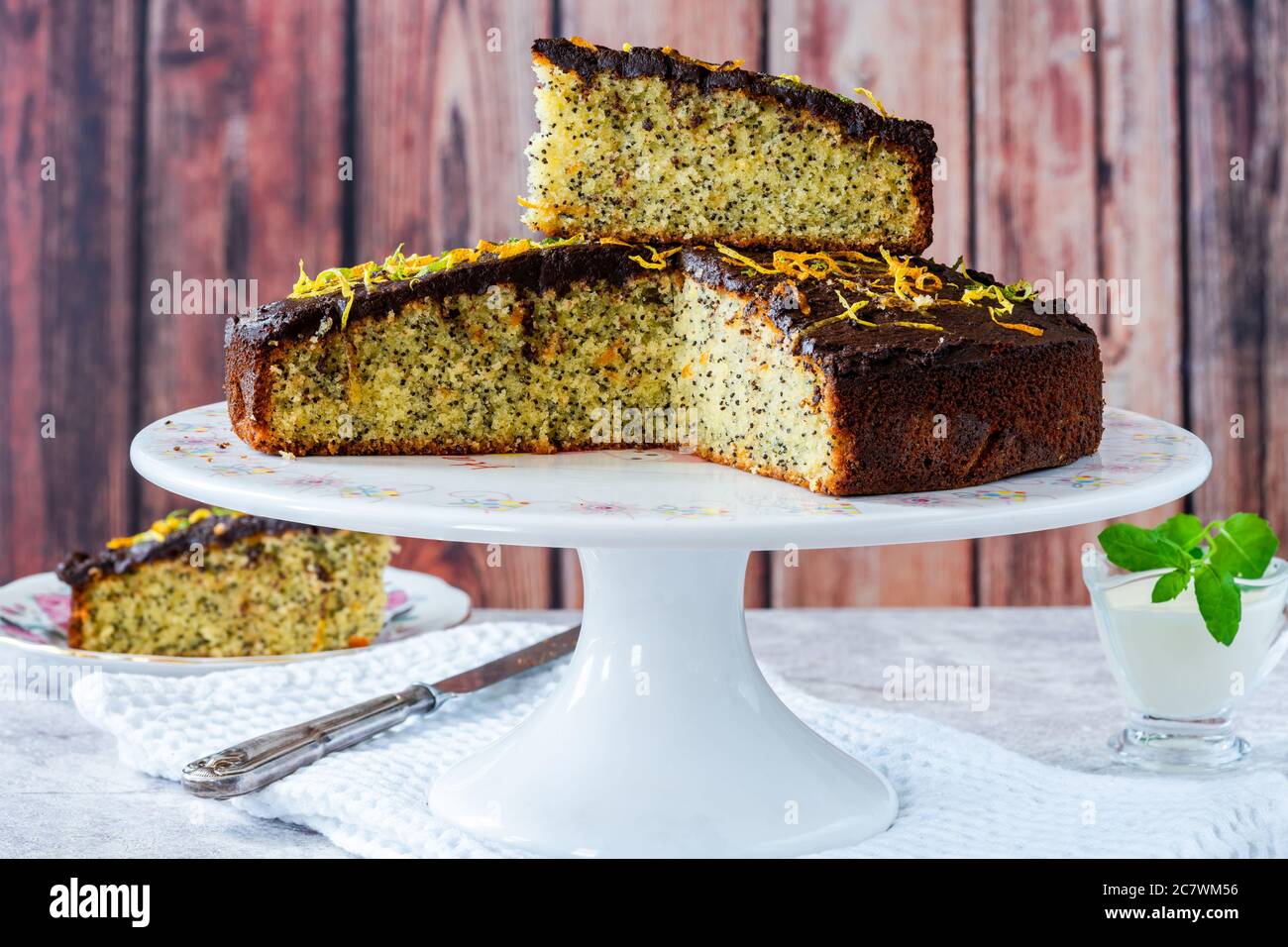 Orange and poppy seed cake with chocolate ganache Stock Photo Alamy