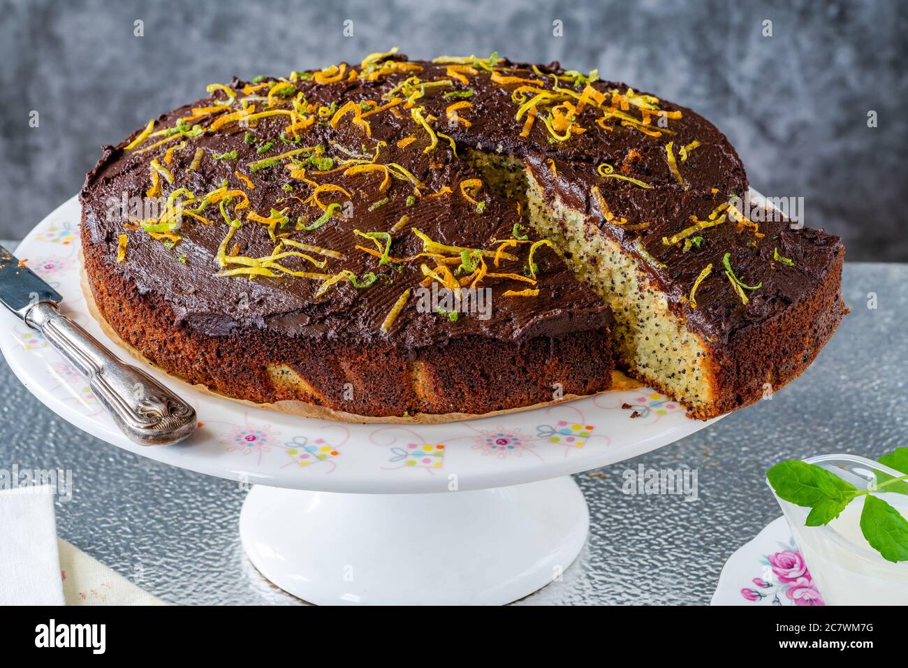 Orange and poppy seed cake with chocolate ganache Stock Photo Alamy