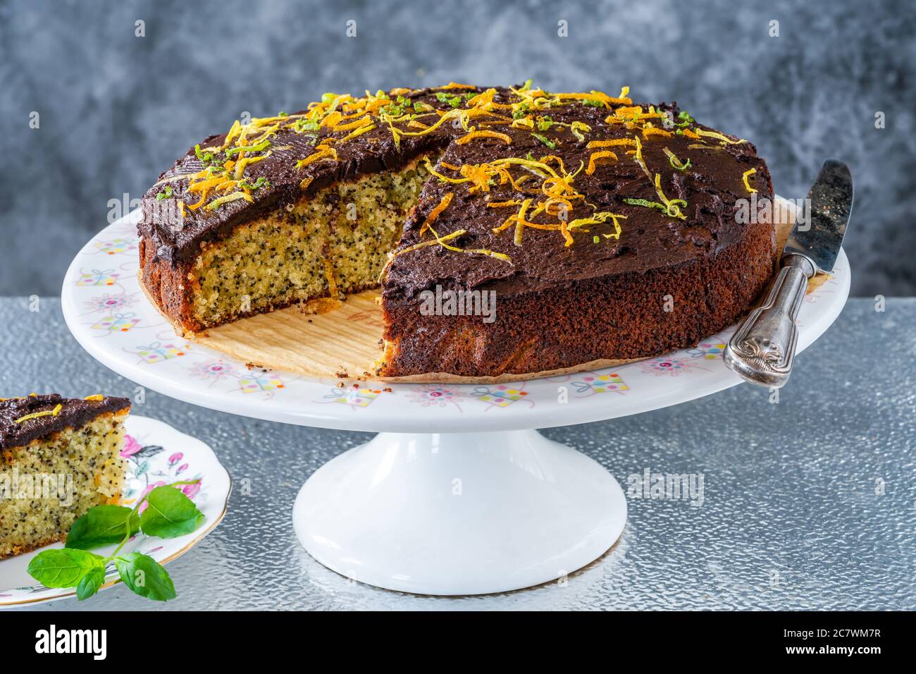 Orange and poppy seed cake with chocolate ganache Stock Photo Alamy