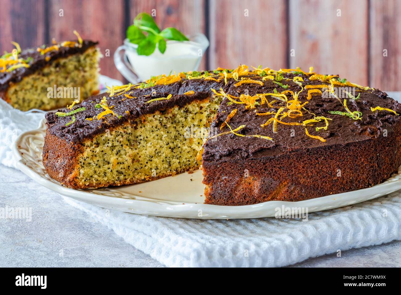 Orange and poppy seed cake with chocolate ganache Stock Photo Alamy