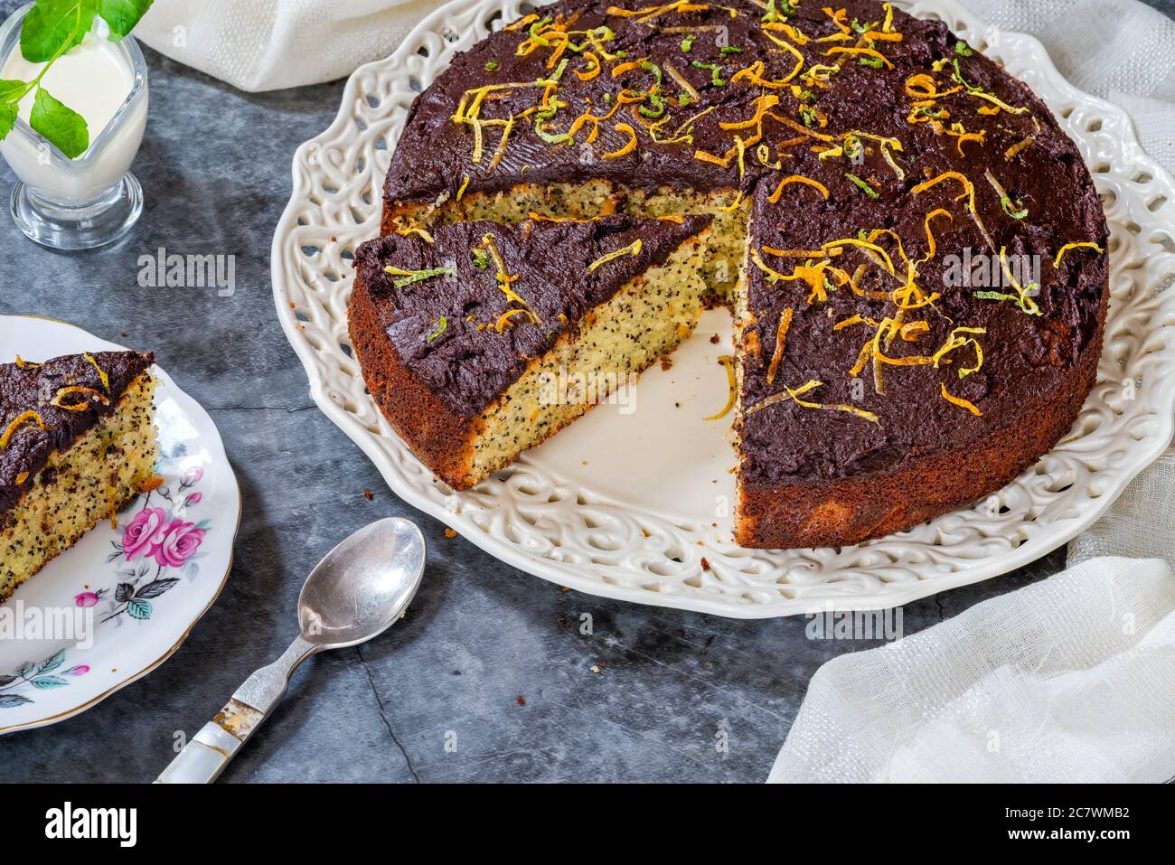 Orange and poppy seed cake with chocolate ganache Stock Photo Alamy