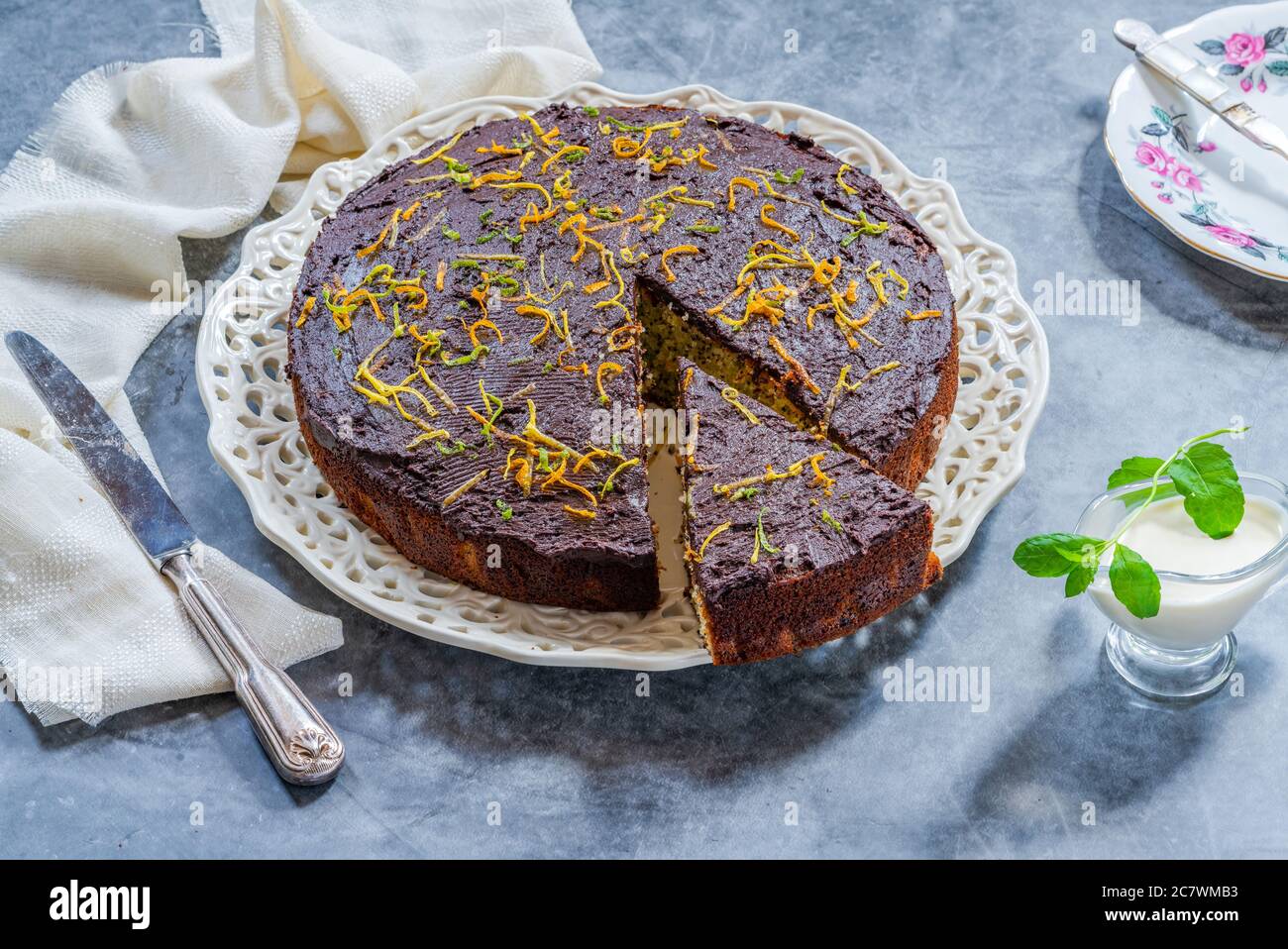 Orange and poppy seed cake with chocolate ganache Stock Photo Alamy