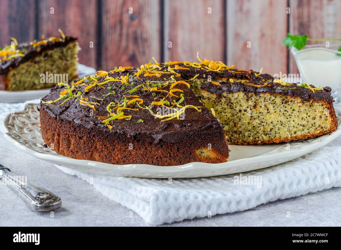 Orange and poppy seed cake with chocolate ganache Stock Photo Alamy