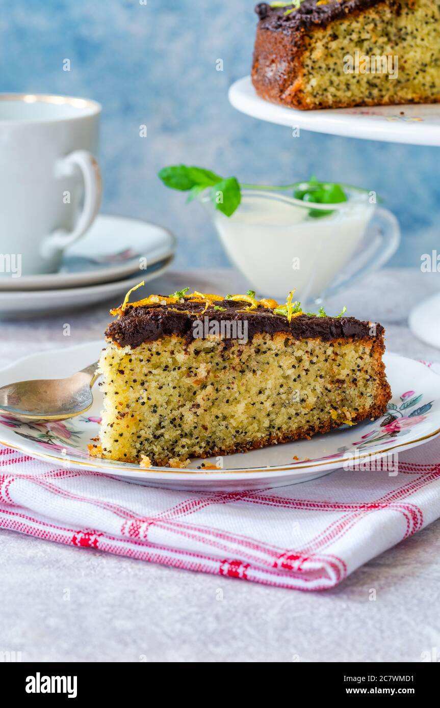 Orange and poppy seed cake with chocolate ganache Stock Photo Alamy