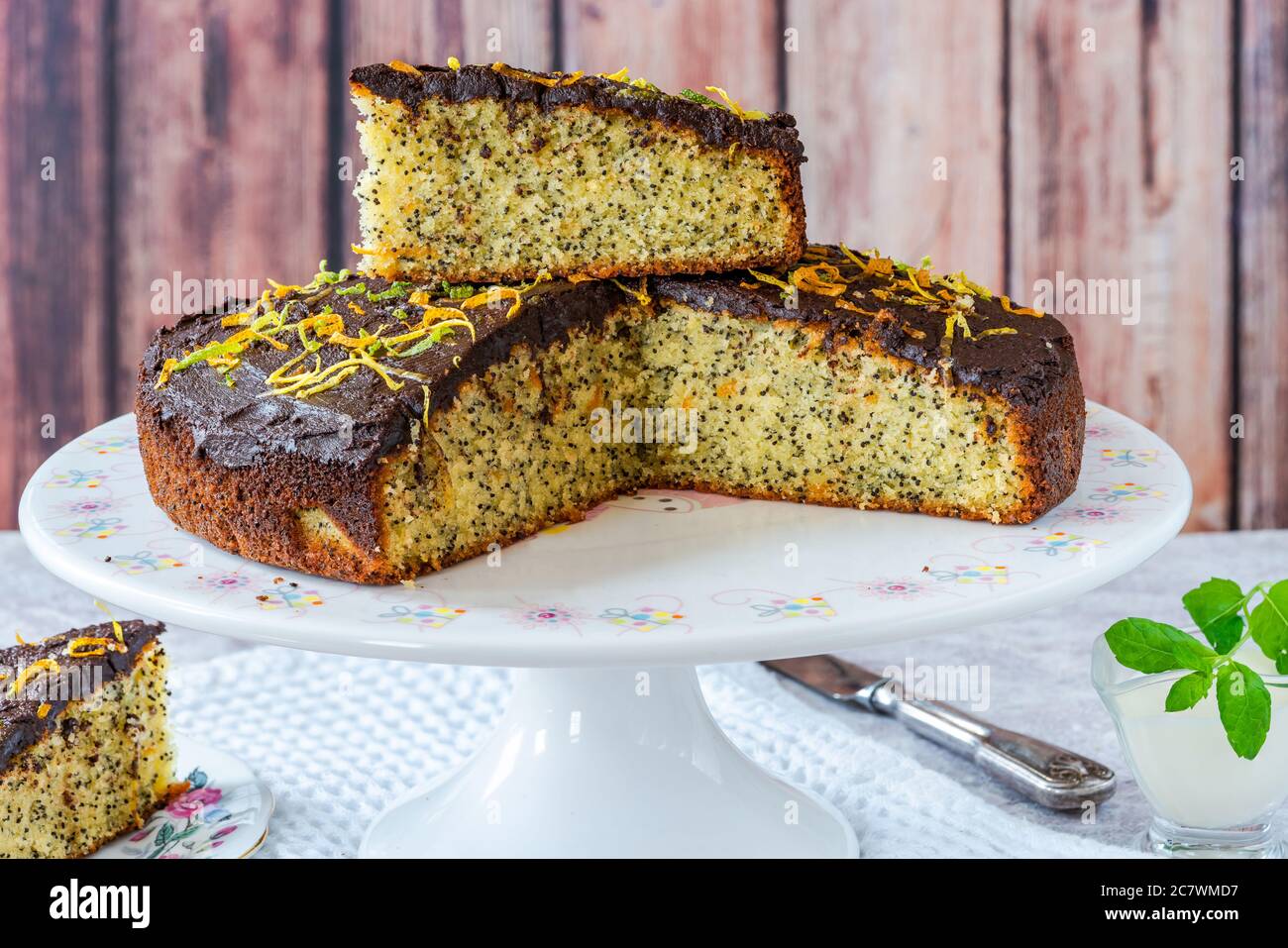 Orange and poppy seed cake with chocolate ganache Stock Photo Alamy