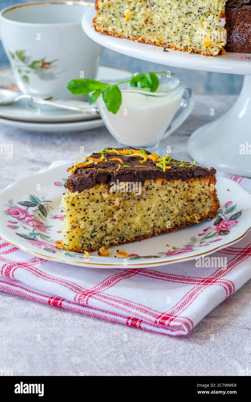 Orange and poppy seed cake with chocolate ganache Stock Photo Alamy
