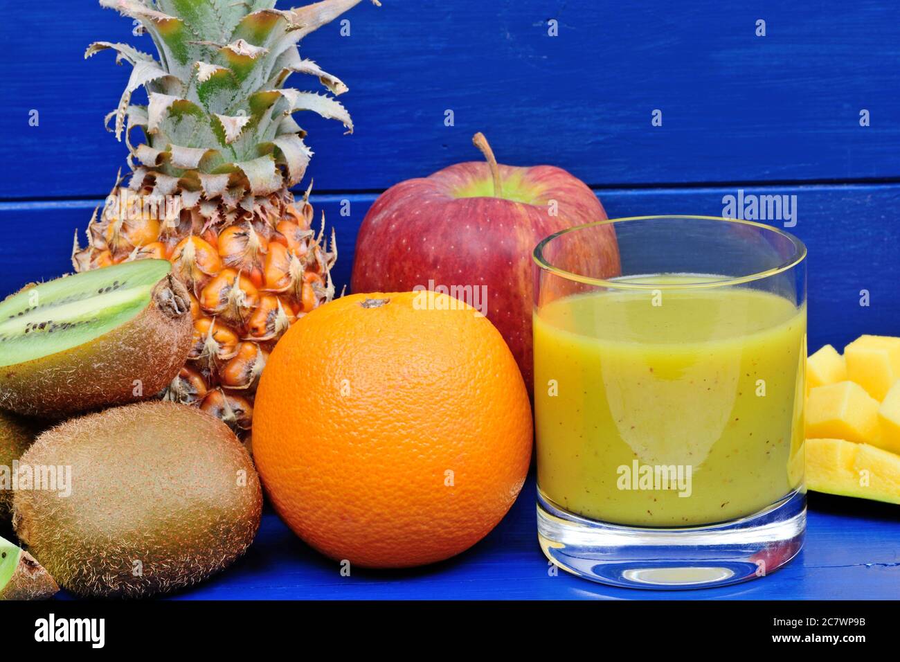 Delicious smoothie in a glass on a blue wood table Stock Photo