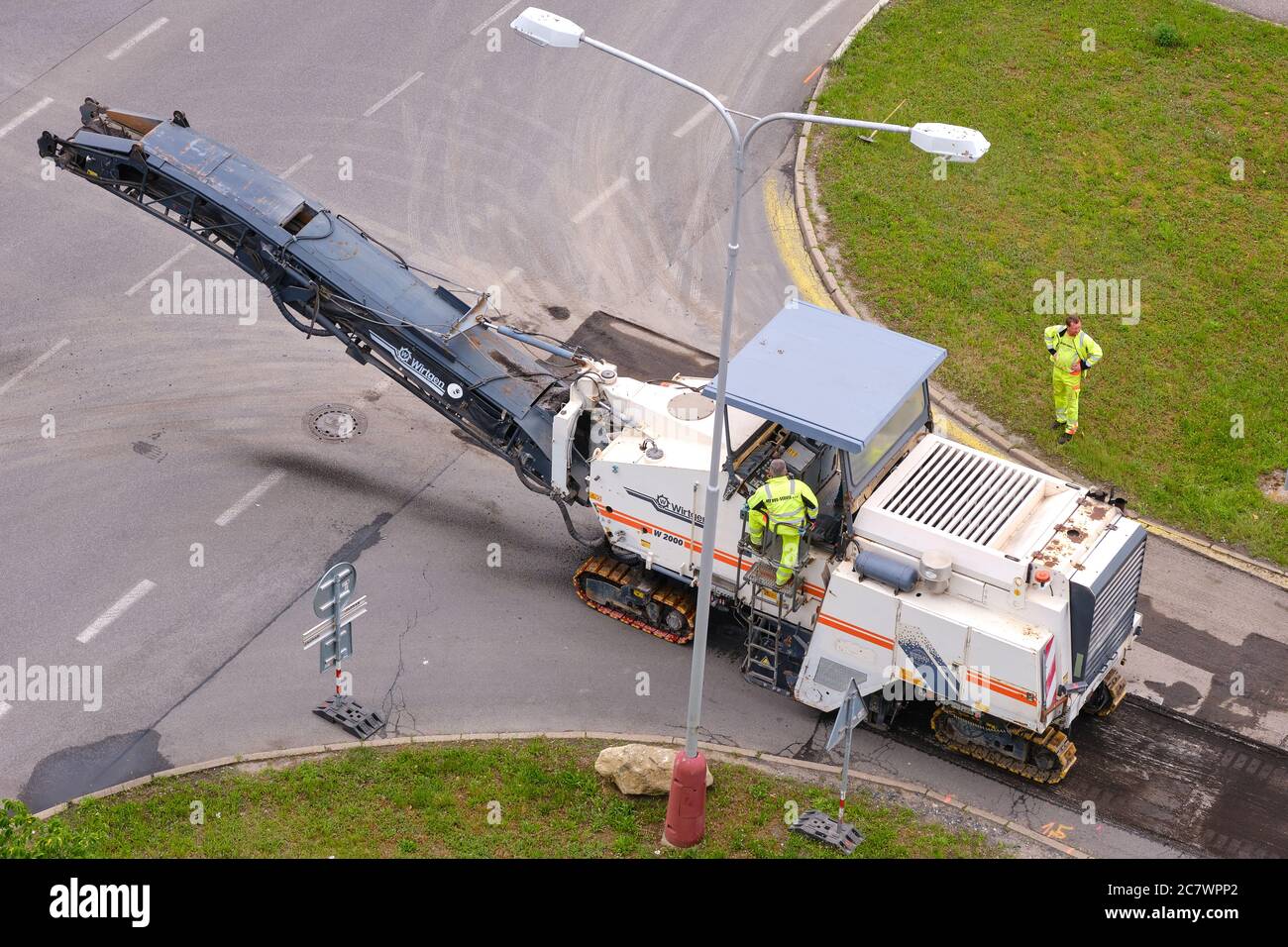 Cold milling machine removing asphalt pavement for repairing the road