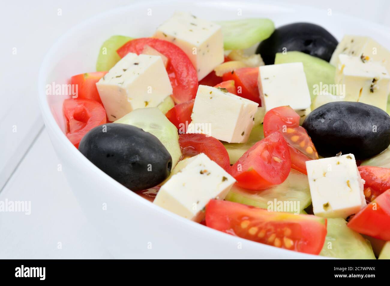 Freshness vegetables salad with cheese in a bowl on table Stock Photo