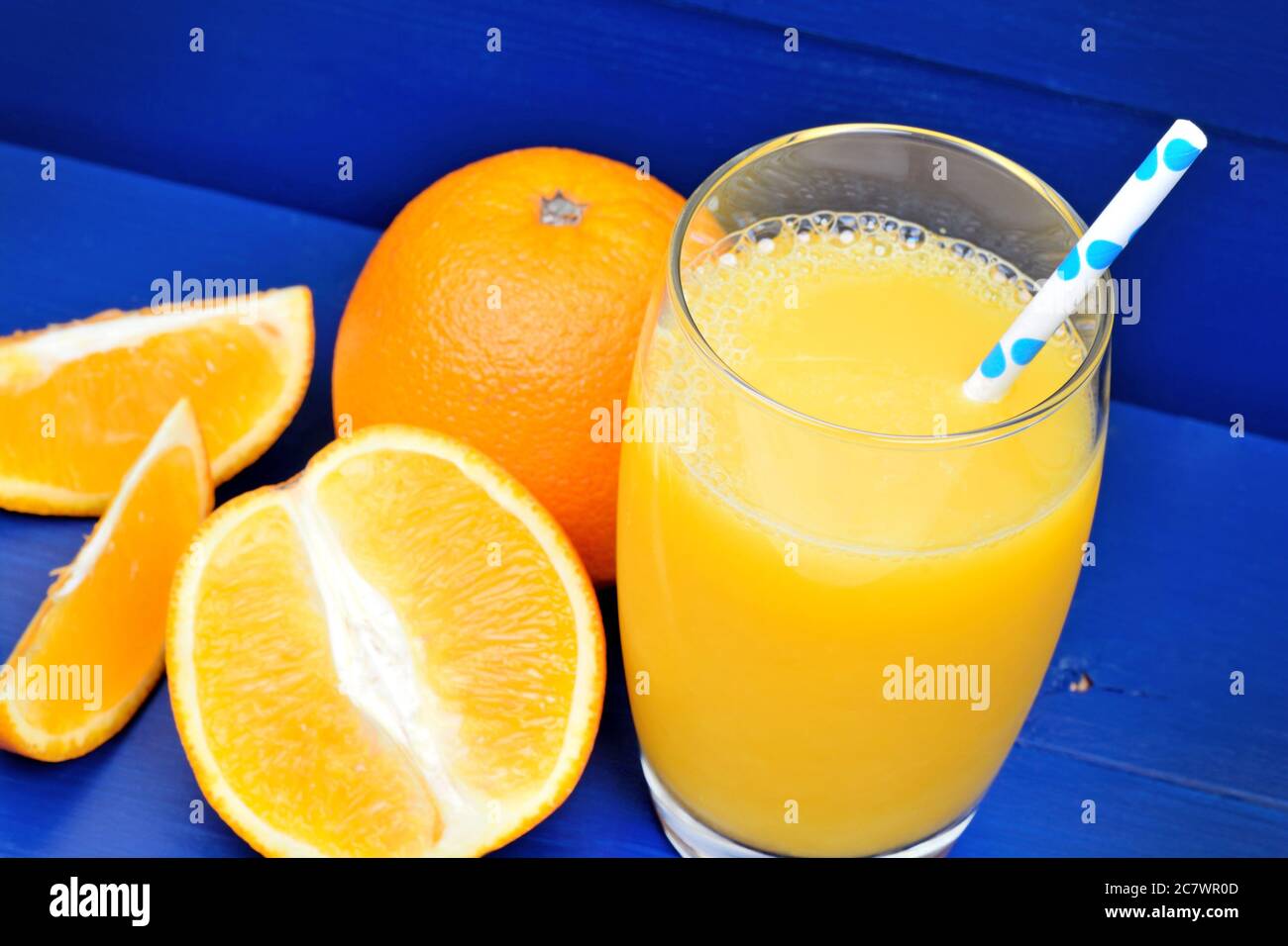 Orange juice in a glass on wooden table Stock Photo