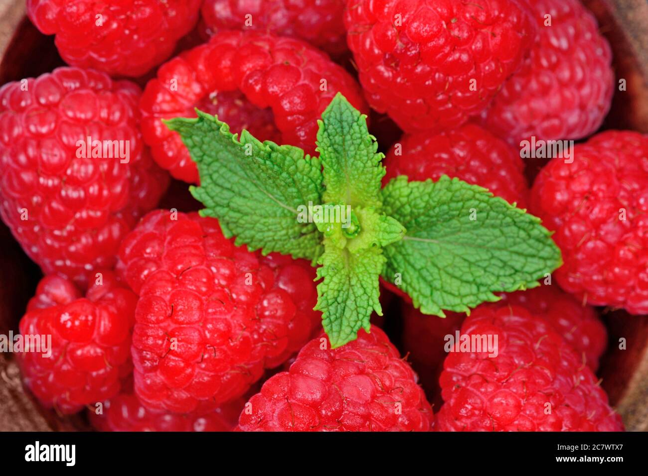 Fresh raspberries in a bowl. Top view Stock Photo